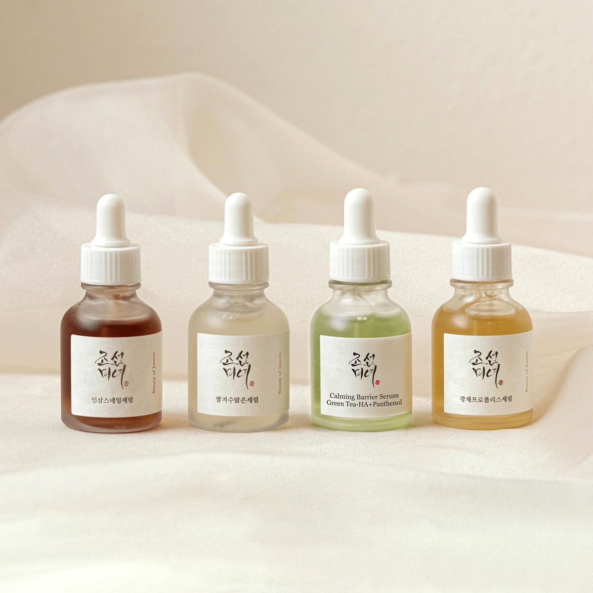 a group of bottles with white caps