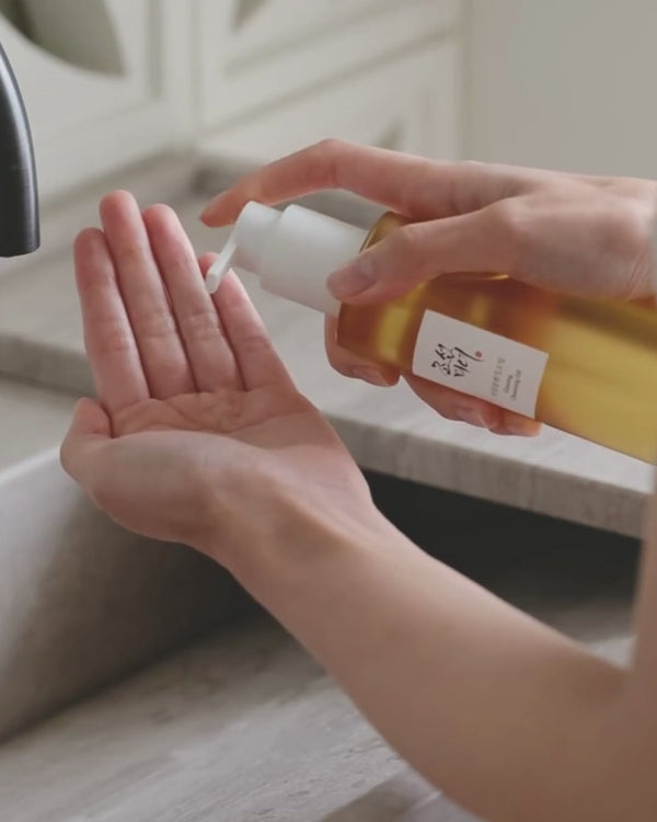 Massaging Hand with Ginseng Cleansing Oil fallback image
